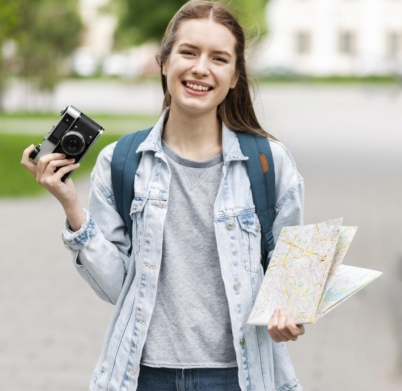 traveller-holding-map-old-camera-photo